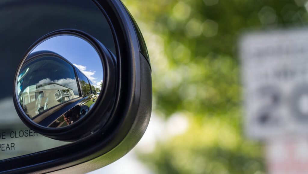 The Science Behind Why Large Vehicles Have Smaller Blind Spots Than Passenger Vehicles